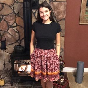 Multi color, multi patterned above the knee skirt.